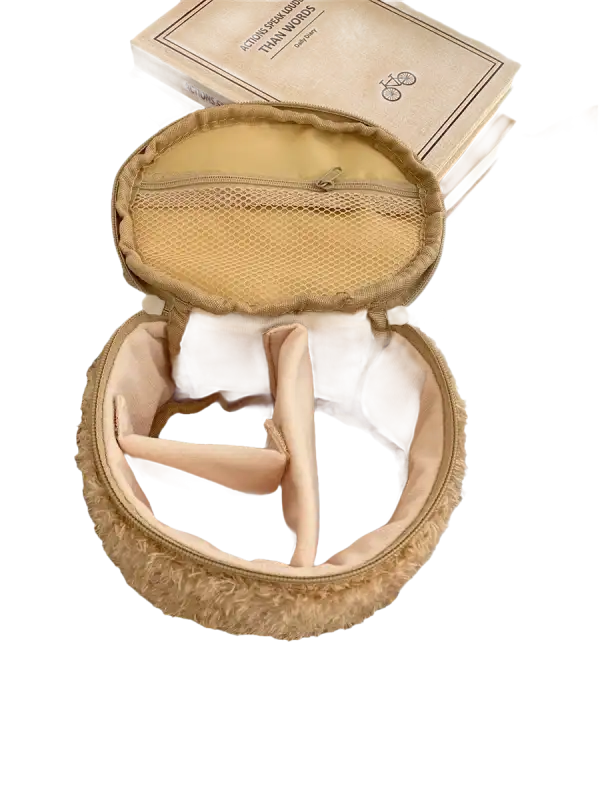 Open, fuzzy, round makeup bag with dividers.