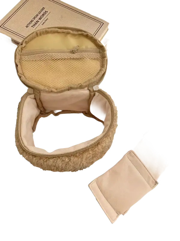 Open, fuzzy, round makeup bag.