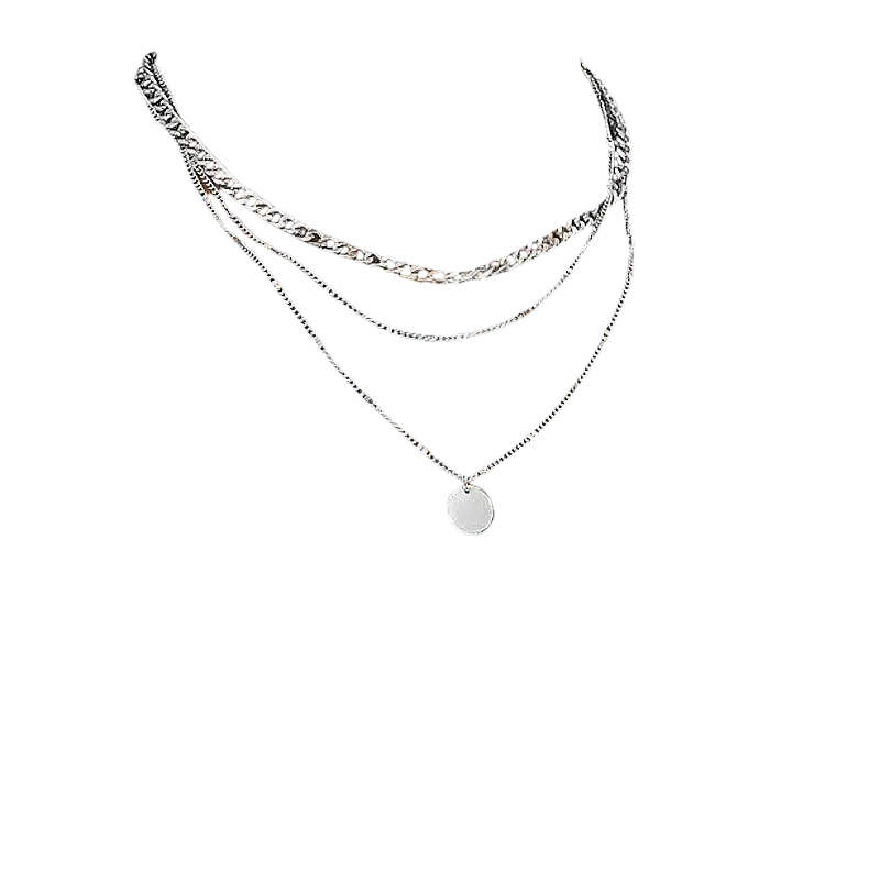 Layered silver necklaces.