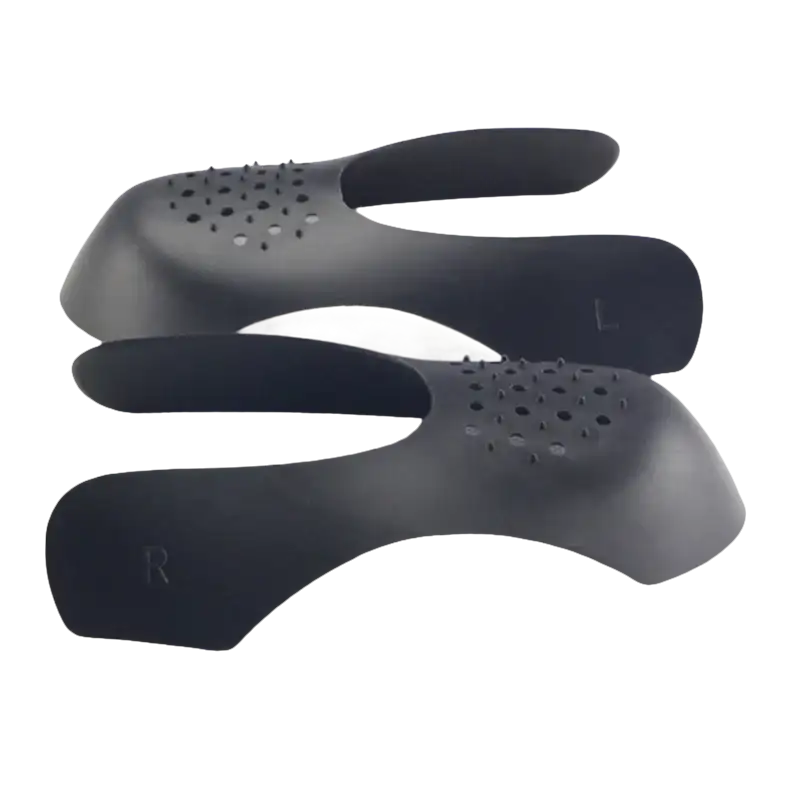 Black shoe trees with ventilation holes.