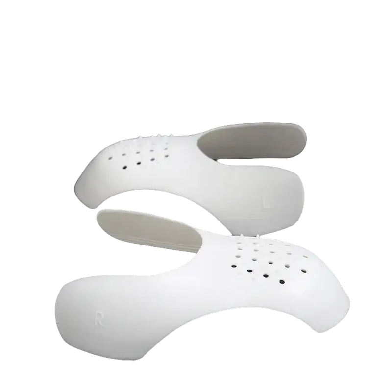 White perforated shoe inserts.