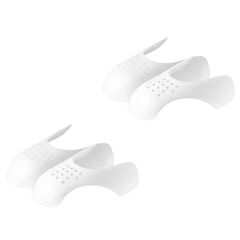 Two pairs of white, perforated shoe inserts.