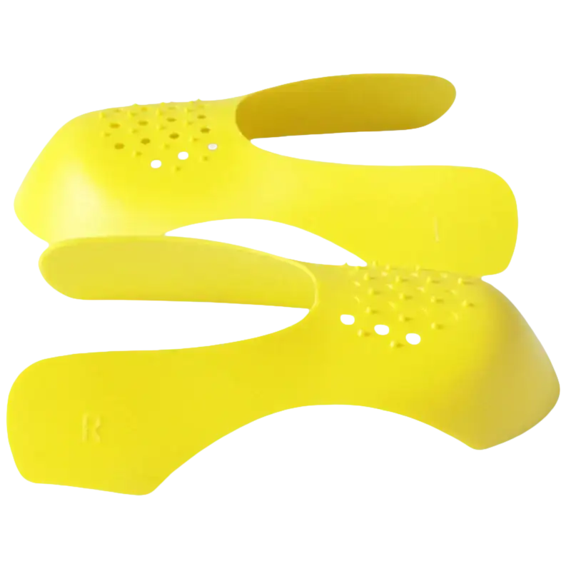 Yellow shoe shields with ventilation holes.
