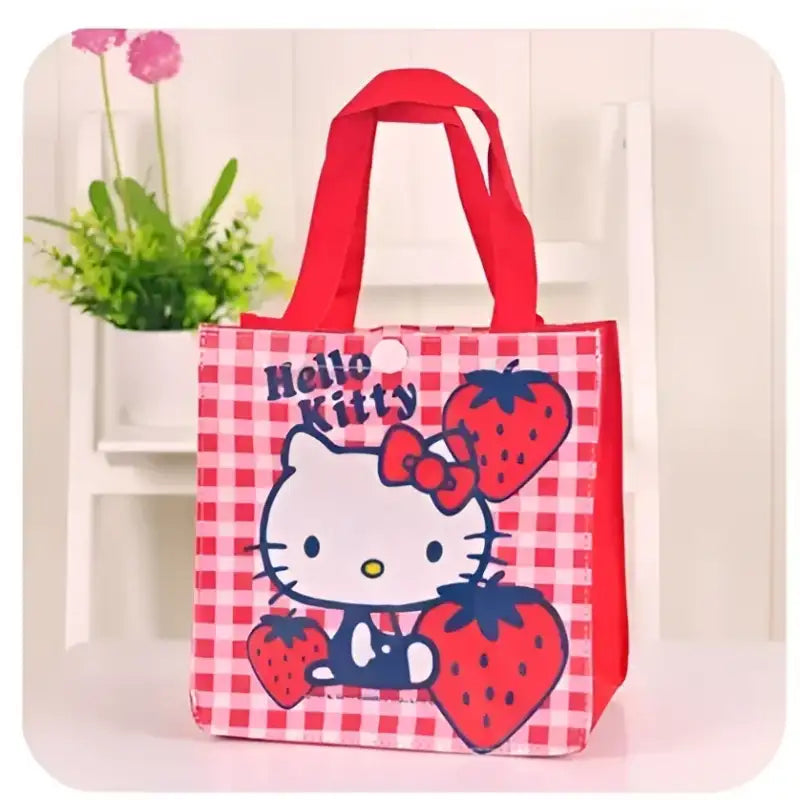 Red-handled Hello Kitty tote bag.