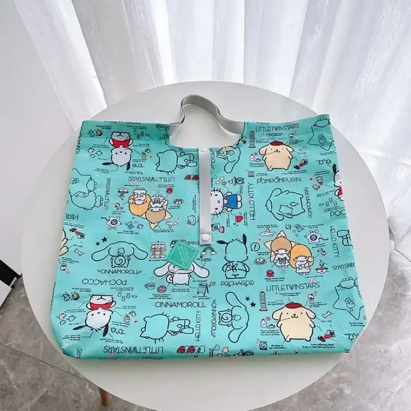 Turquoise cartoon character tote bag.