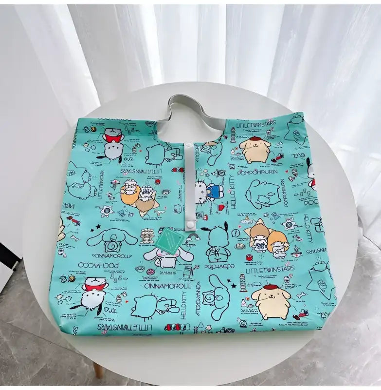 Turquoise cartoon-character tote bag.
