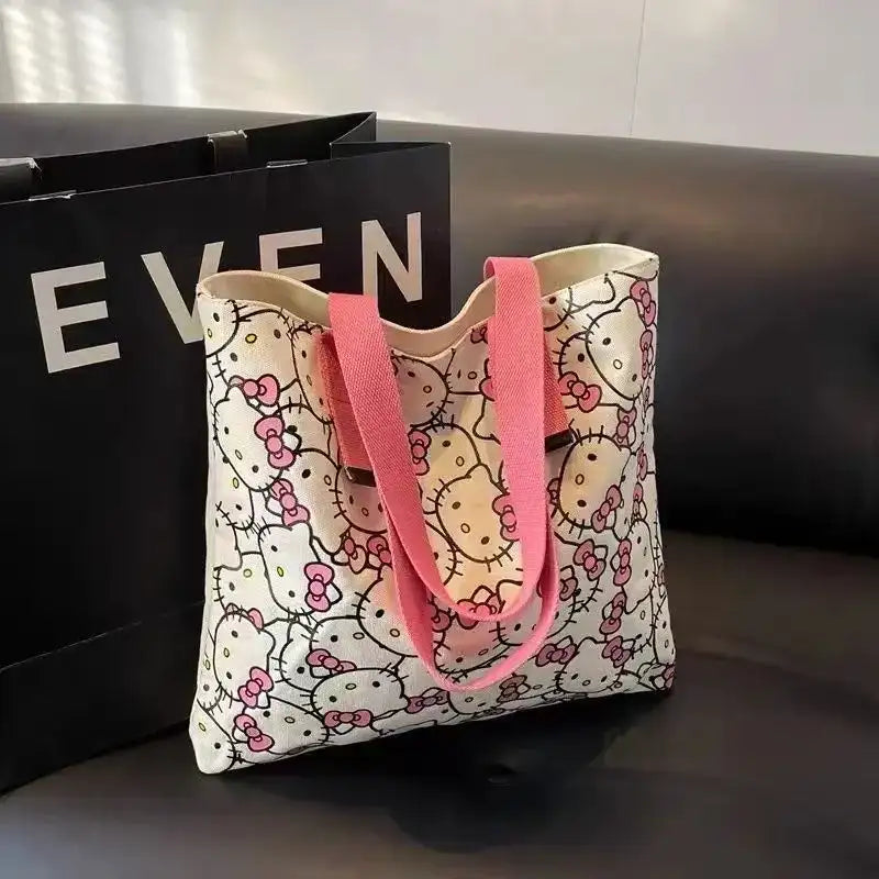 Hello Kitty patterned tote bag with pink straps.