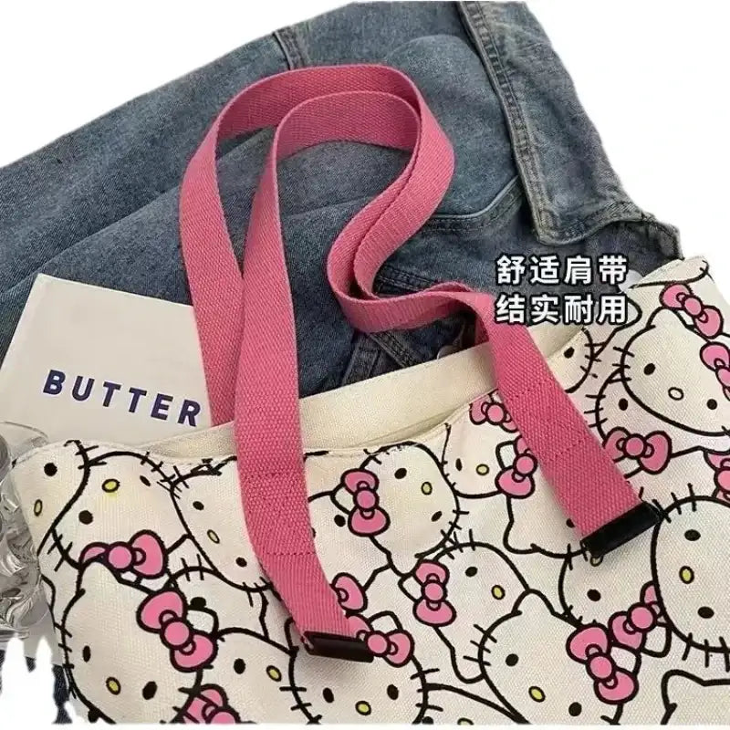 Hello Kitty patterned tote bag with pink straps.