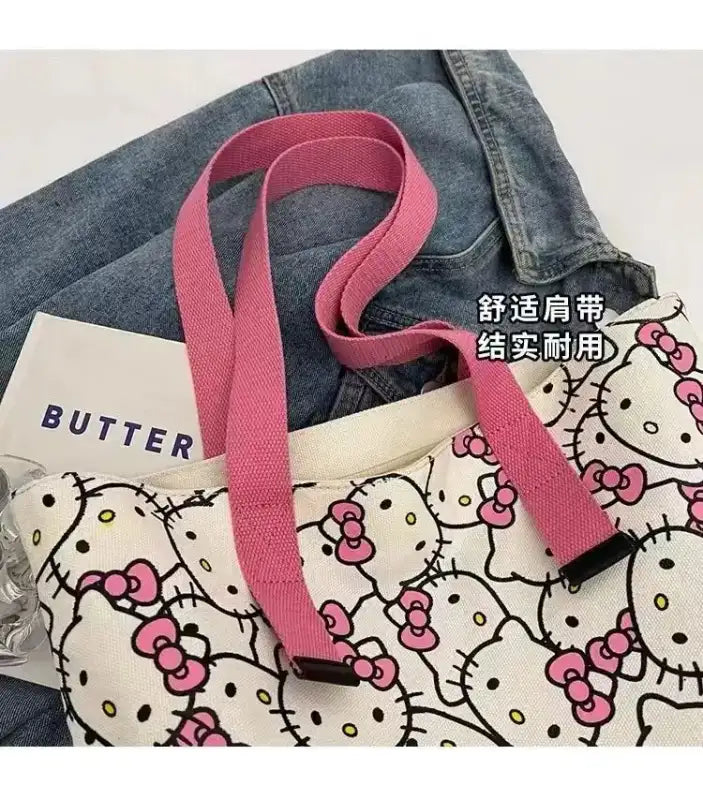 Hello Kitty patterned tote bag with pink straps.