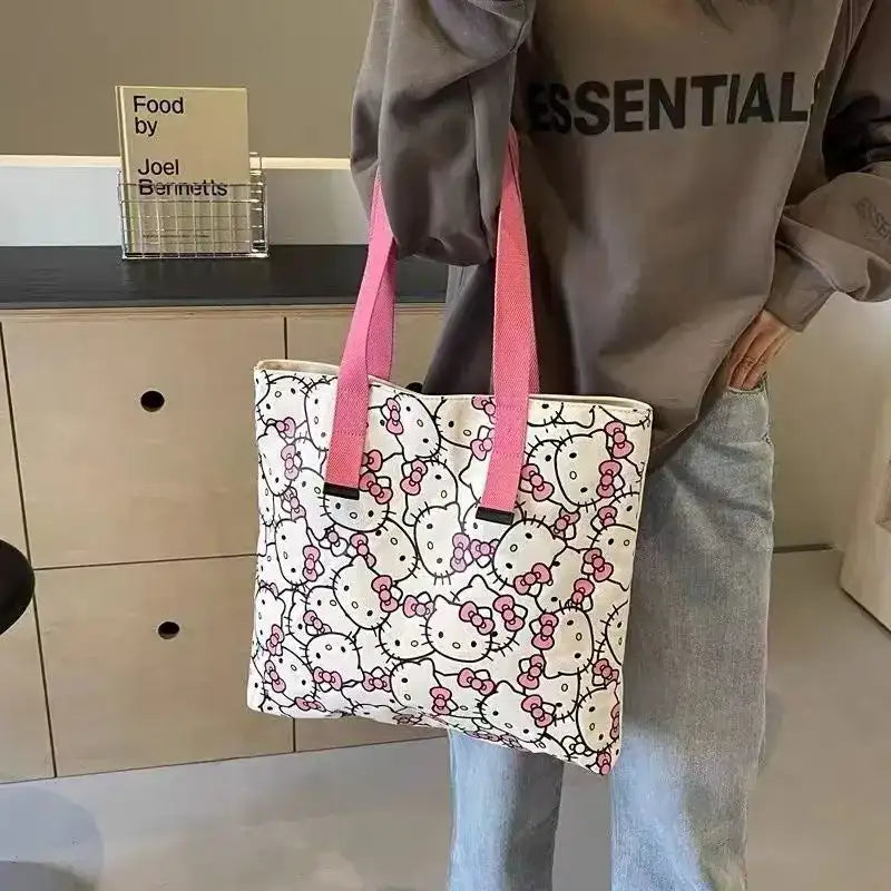 Hello Kitty tote bag with pink straps.