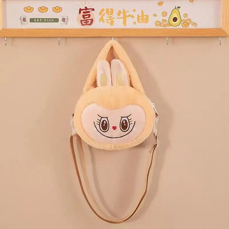 Plush bunny purse with shoulder strap.