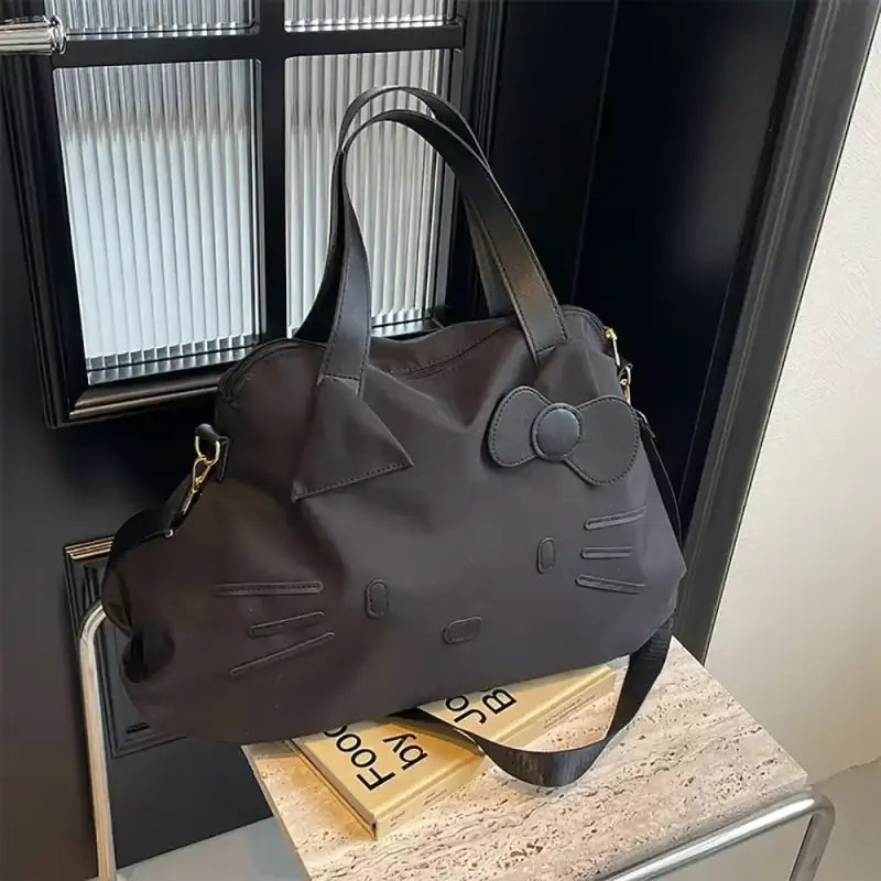 Black Hello Kitty tote bag.
