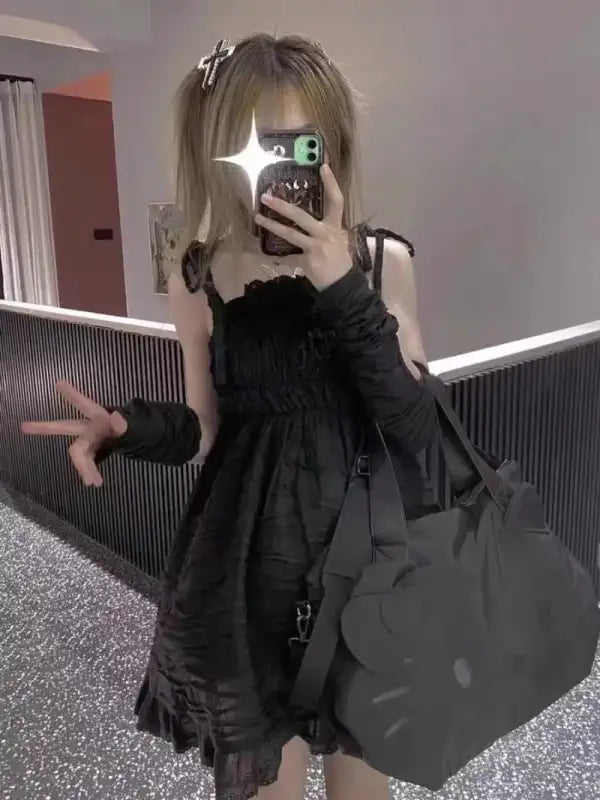 Black dress with Hello Kitty bag.