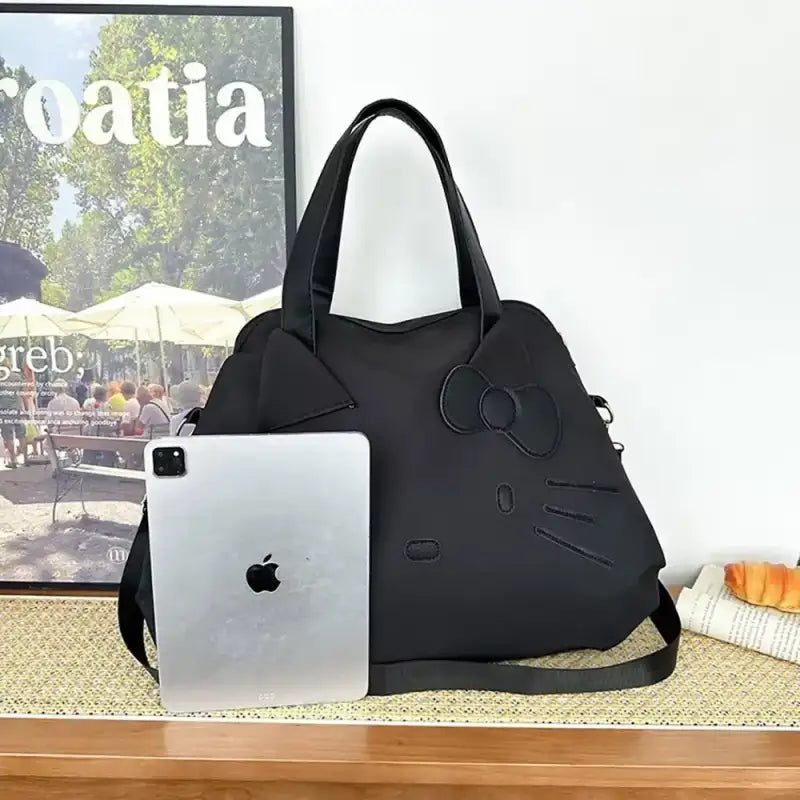Black Hello Kitty handbag.