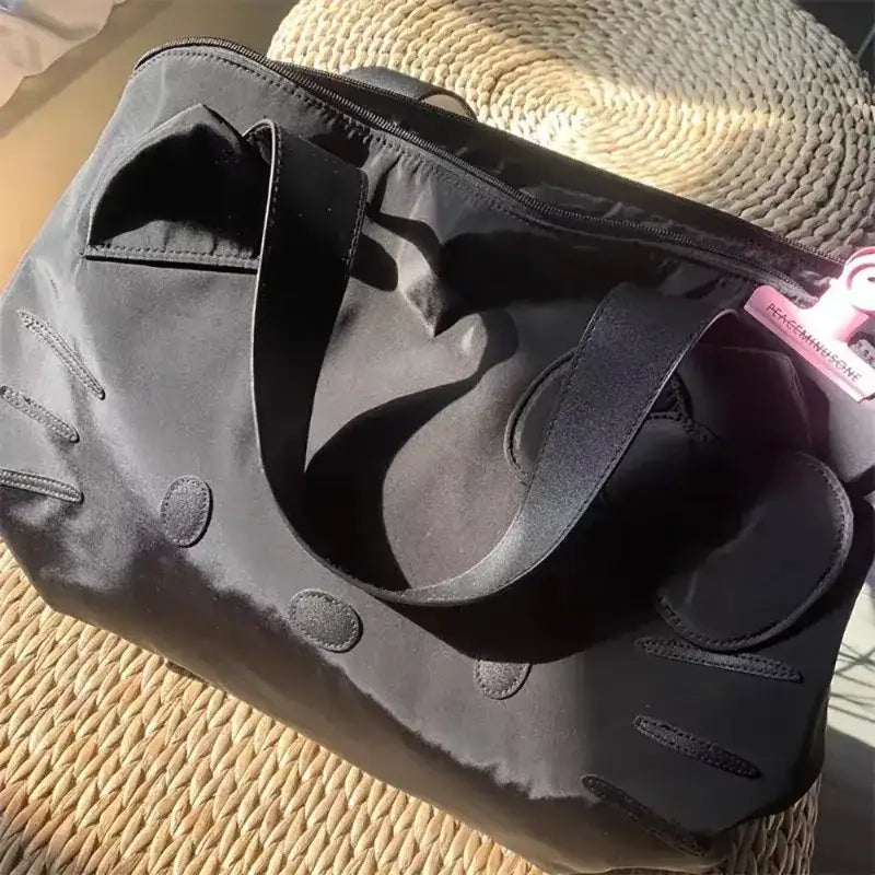 Black nylon tote bag.
