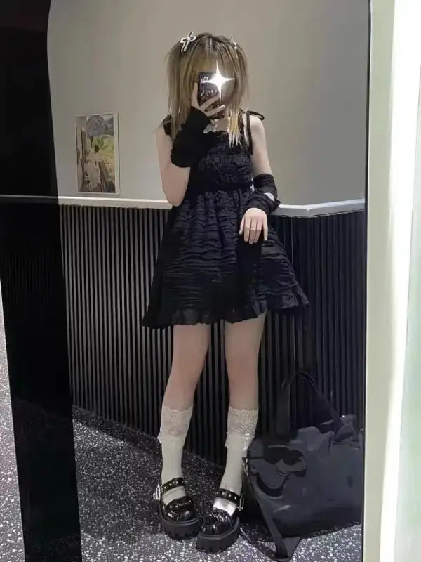 Woman in black dress with platform shoes.