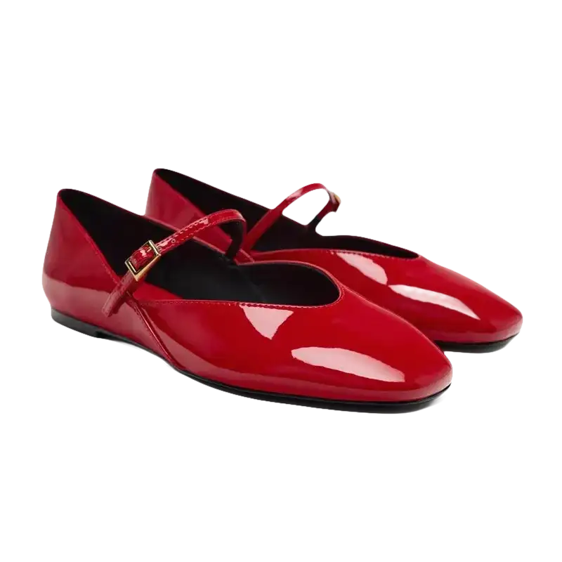 Pair of red patent leather Mary Jane flats.