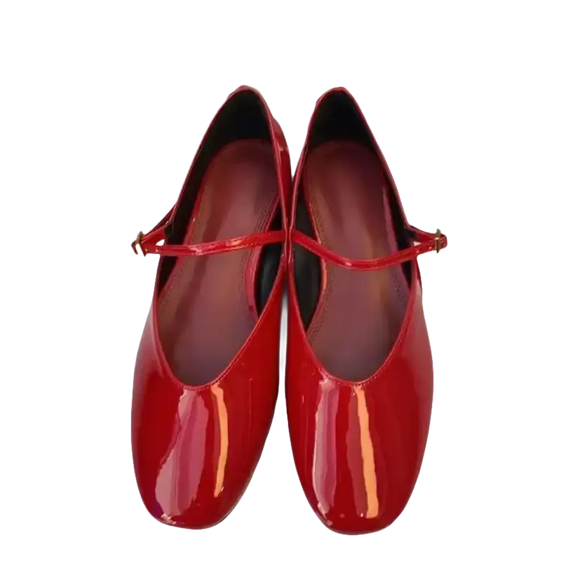 Pair of red patent leather Mary Jane shoes.