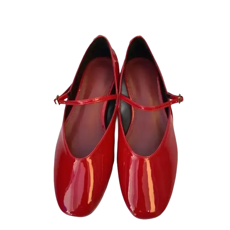 Pair of shiny red Mary Jane shoes.