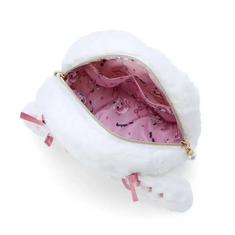 Open white plush purse with pink interior.