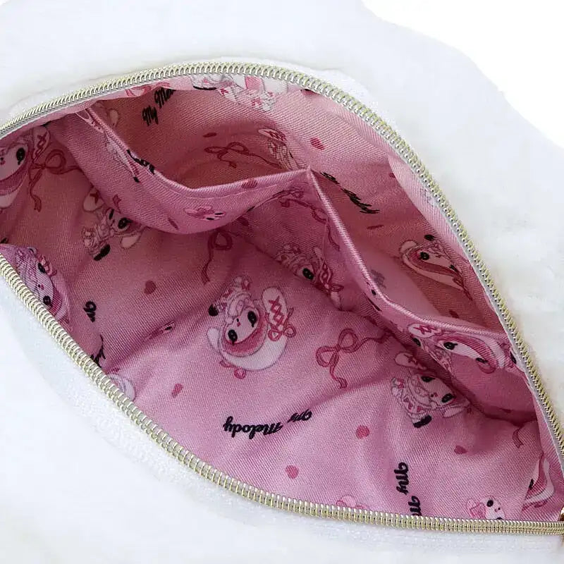 Open white purse with pink interior.