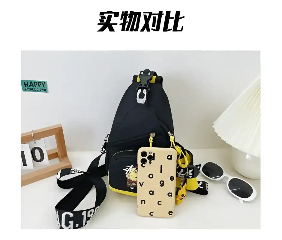 Black sling bag with yellow accents.