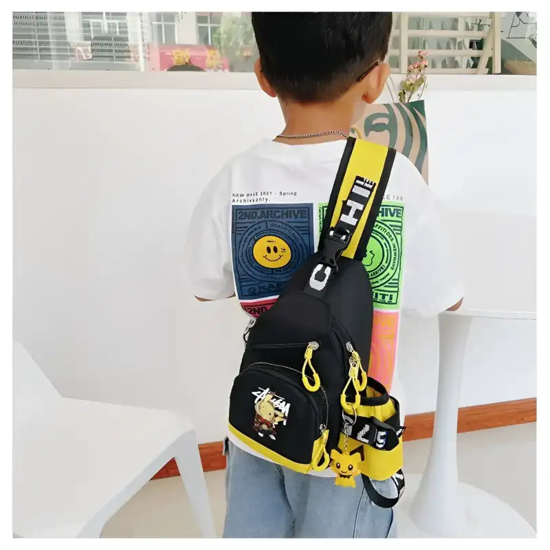 Black sling bag with yellow accents.