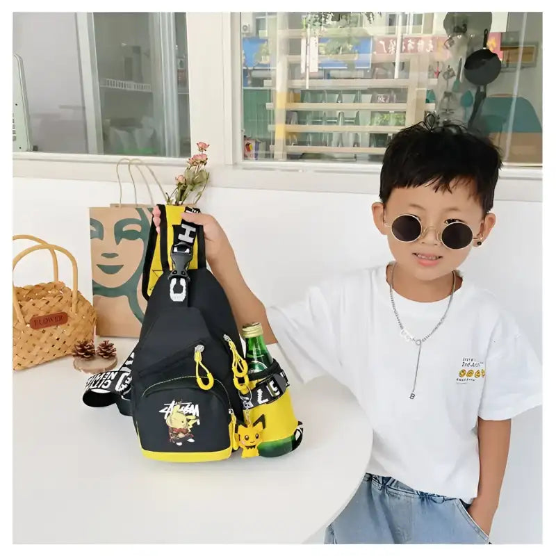 Black and yellow cartoon-themed sling bag.