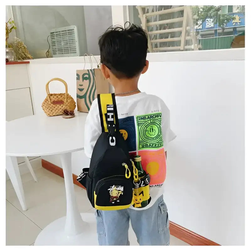 Child’s black and yellow cartoon-themed sling bag.
