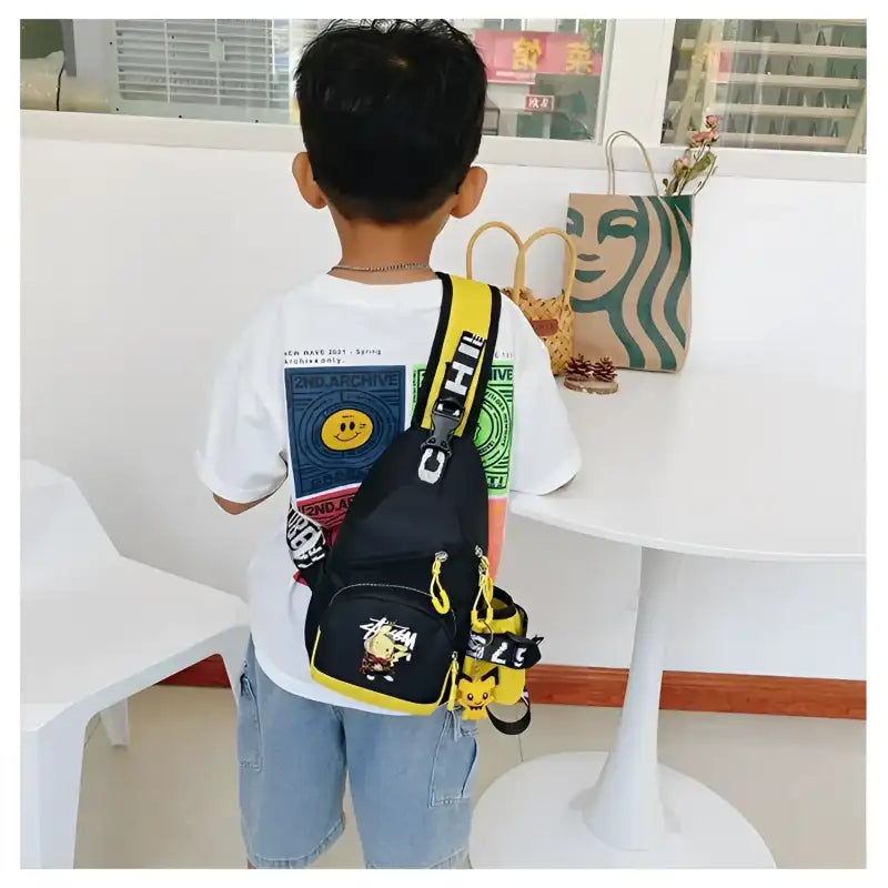 Child’s black and yellow sling bag.