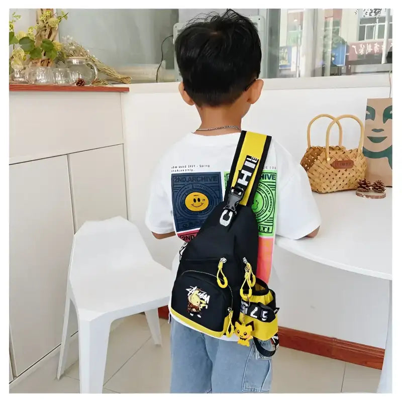 Child’s black and yellow sling bag.