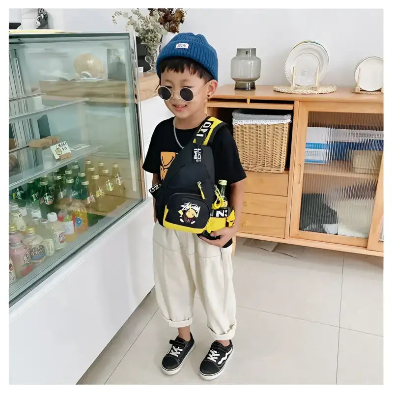 Child’s black and yellow sling bag.