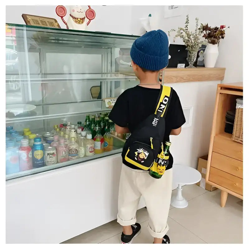Child’s black and yellow sling bag.