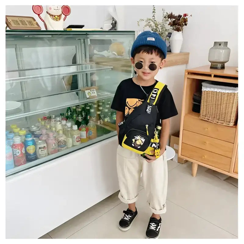 Child’s black and yellow sling bag.