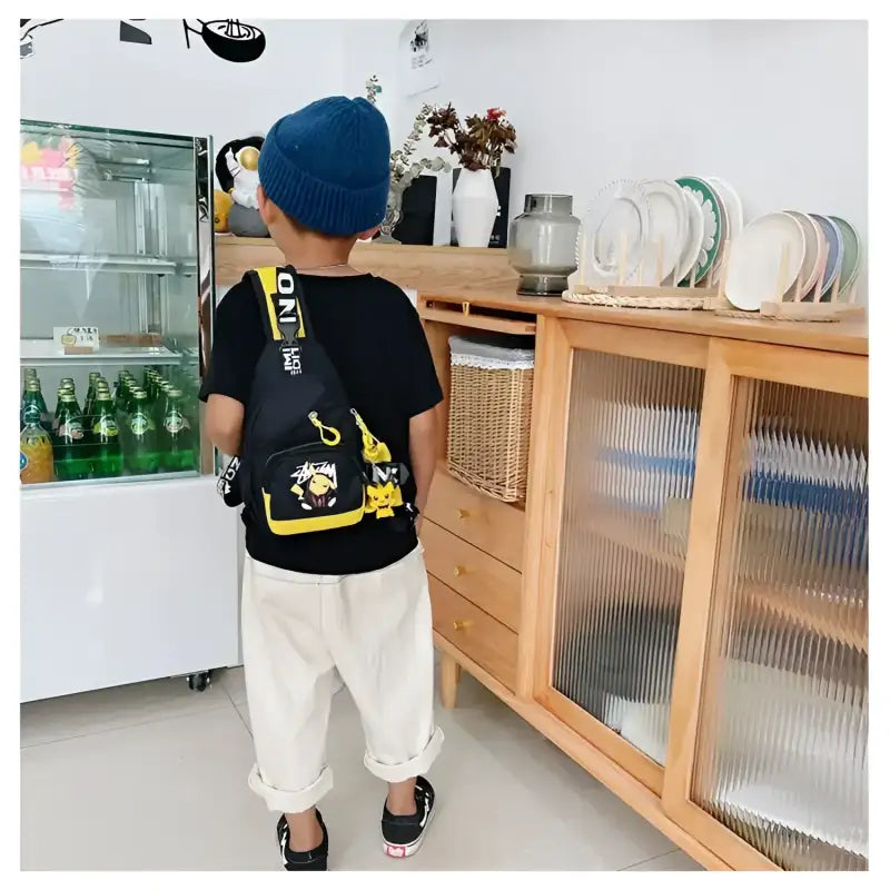 Child’s black and yellow sling bag.
