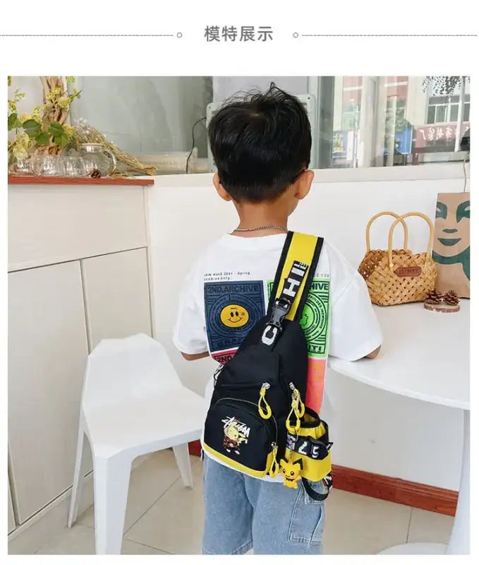 Child’s black and yellow sling bag.