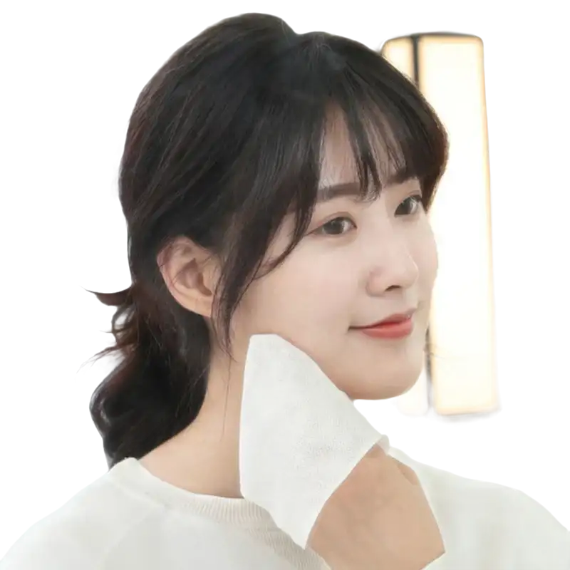 Woman wiping face with white cloth.
