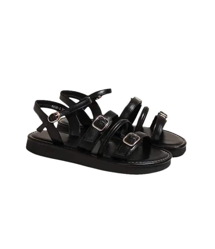 Black buckled platform sandals.