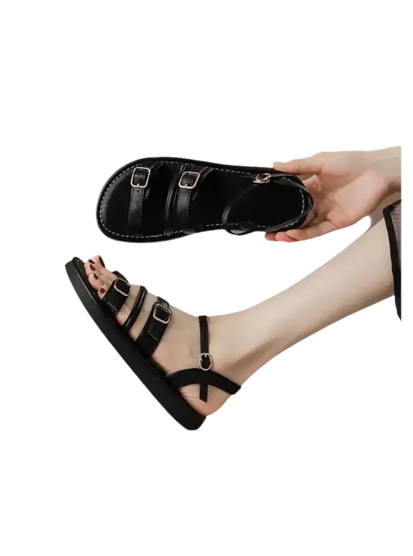 Black buckled sandal.