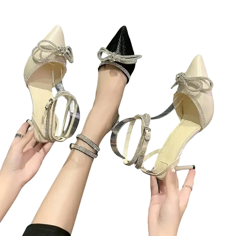 Elegant high-heeled shoes with rhinestone bows.