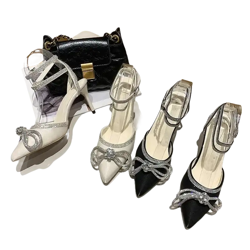 Elegant high-heeled shoes with rhinestone bows.