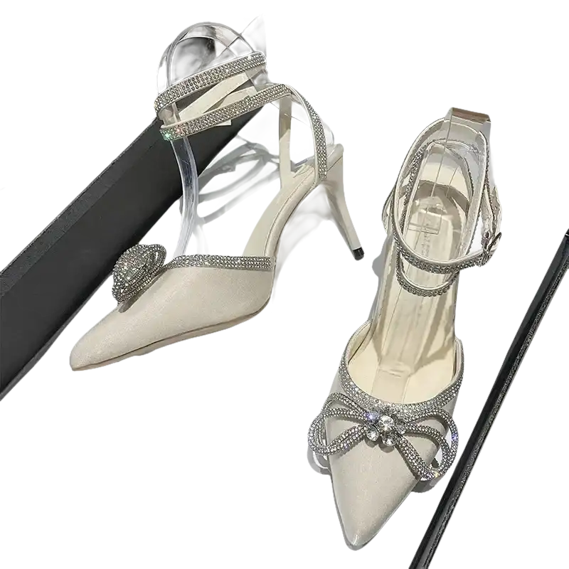 Elegant, pointed-toe high heels with rhinestone embellishments.