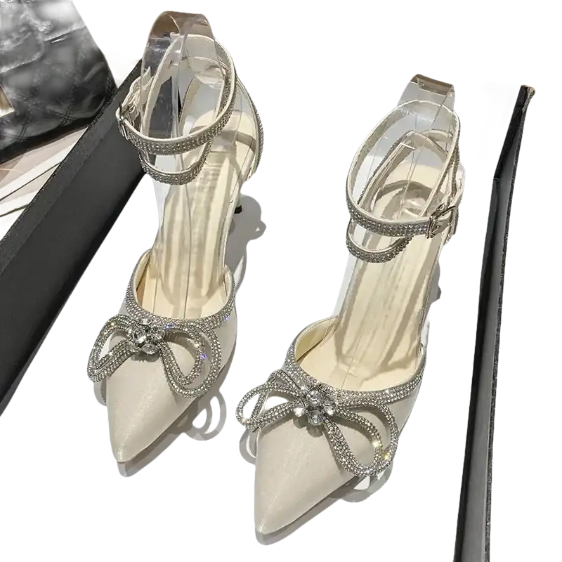 Rhinestone-embellished high-heeled shoes.