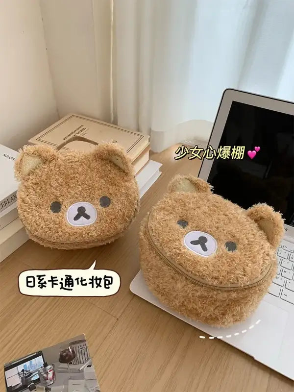Fuzzy bear-shaped cosmetic bags.