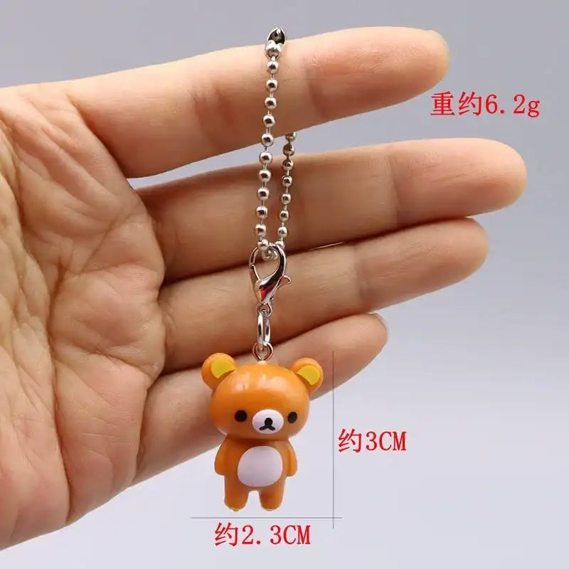 Brown bear keychain with silver ball chain.