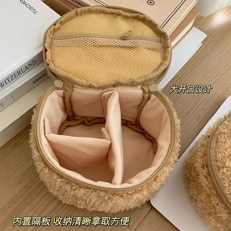 Open, fuzzy, round makeup bag.