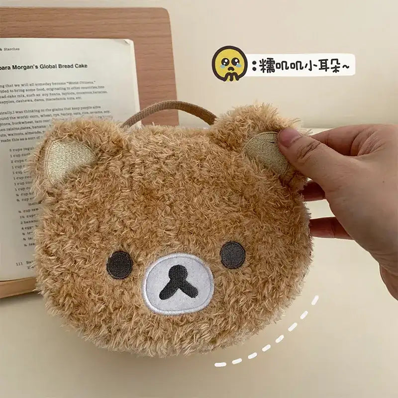 Round, fuzzy, brown bear purse.