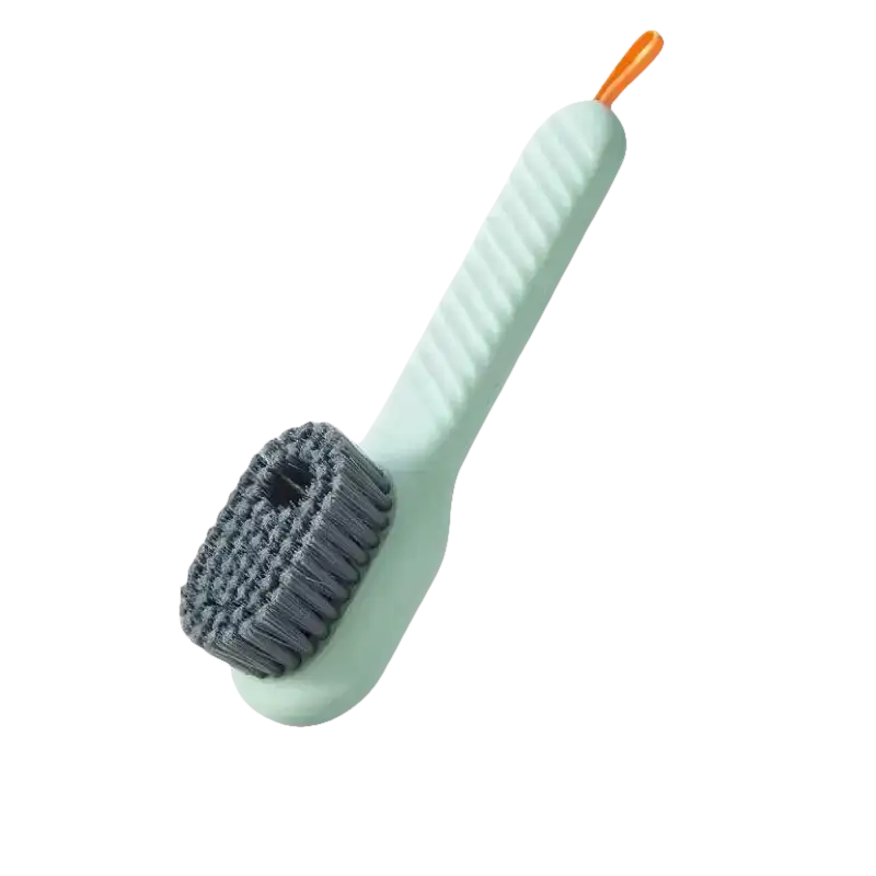 Light green cleaning brush with gray bristles and orange loop.