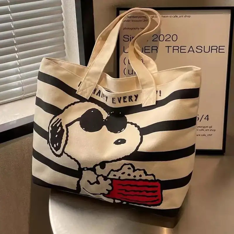 Snoopy-themed striped tote bag.