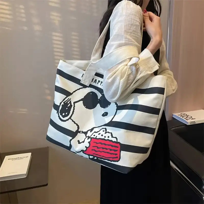 Striped tote bag with cartoon character.